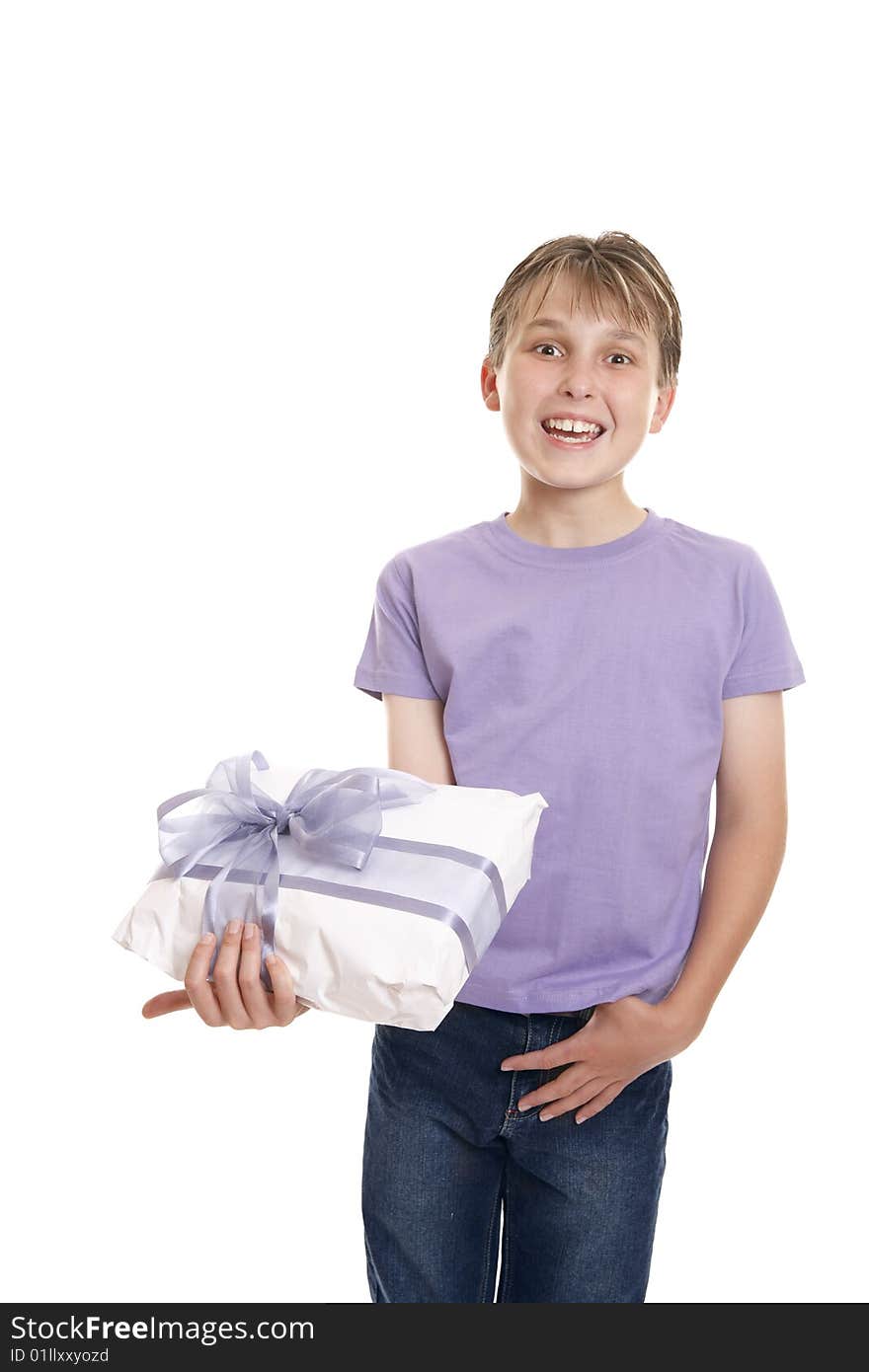 Excited  boy in plain t-shirt and jeans holding a wrapped present ready for birthday or other special occasion. Excited  boy in plain t-shirt and jeans holding a wrapped present ready for birthday or other special occasion.