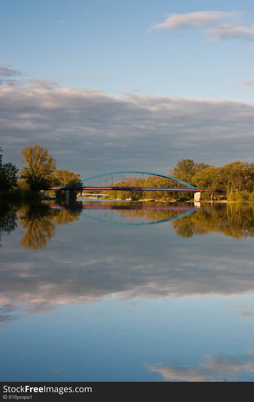 Bridge and Reflection On The River