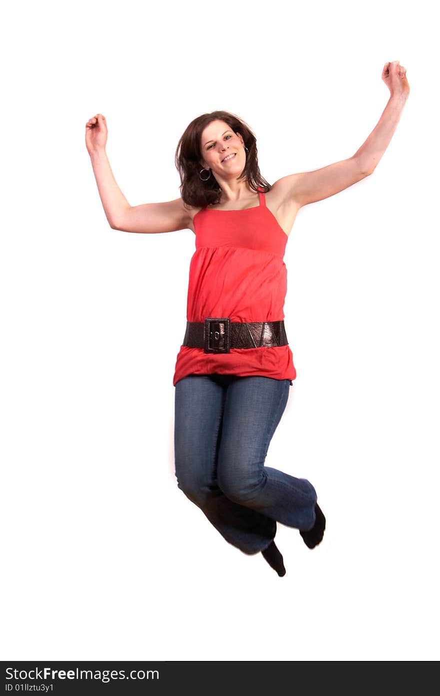 A young woman is jumping happy. Slight motion bluriness is intended! Isolated over white. A young woman is jumping happy. Slight motion bluriness is intended! Isolated over white.