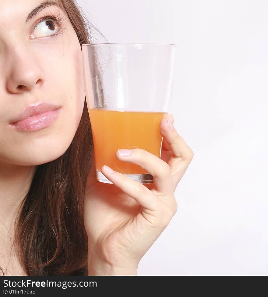 Portrait of the girl with a glass of orange juice. Portrait of the girl with a glass of orange juice.