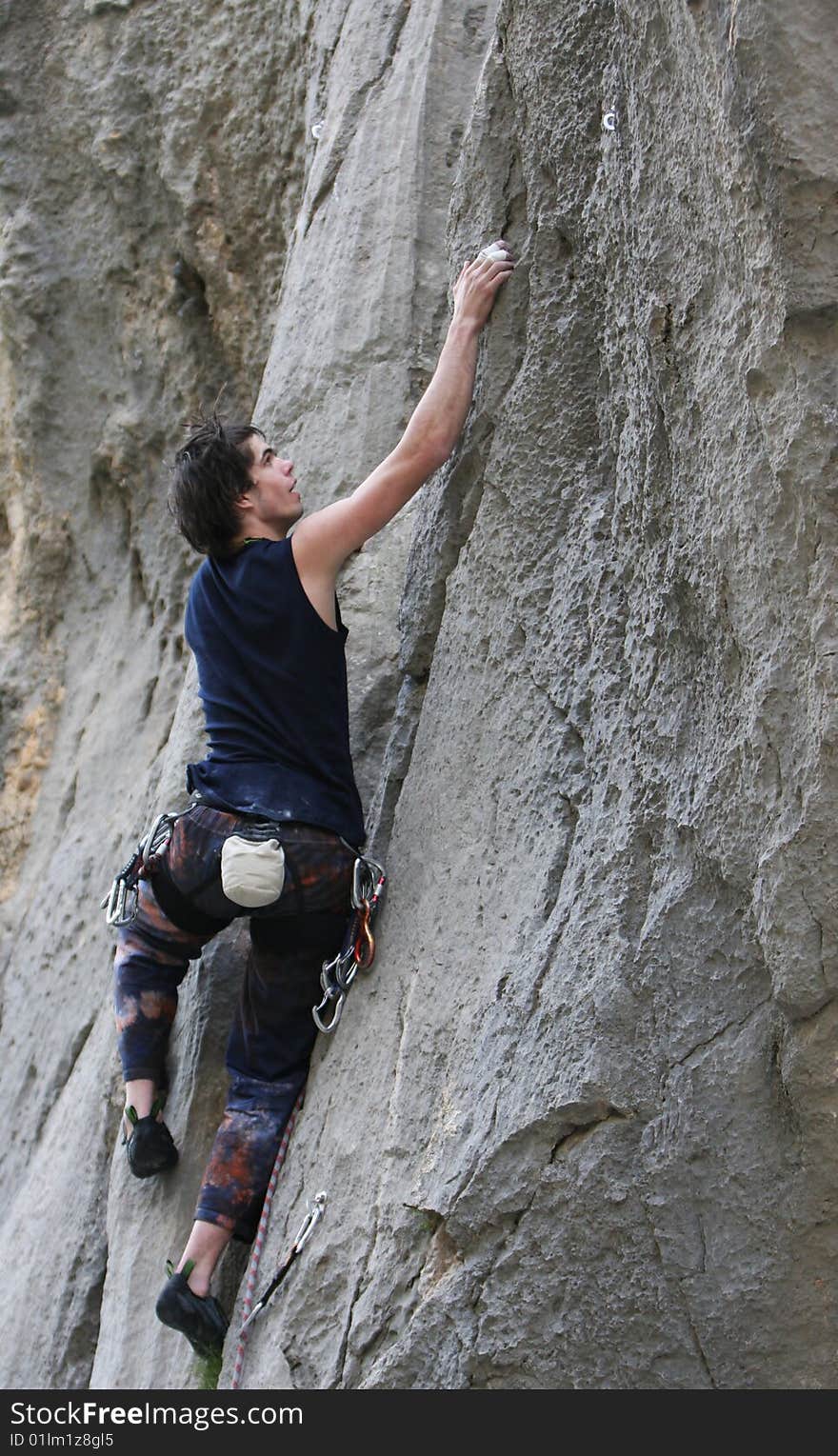 Climber in action on limestone rock