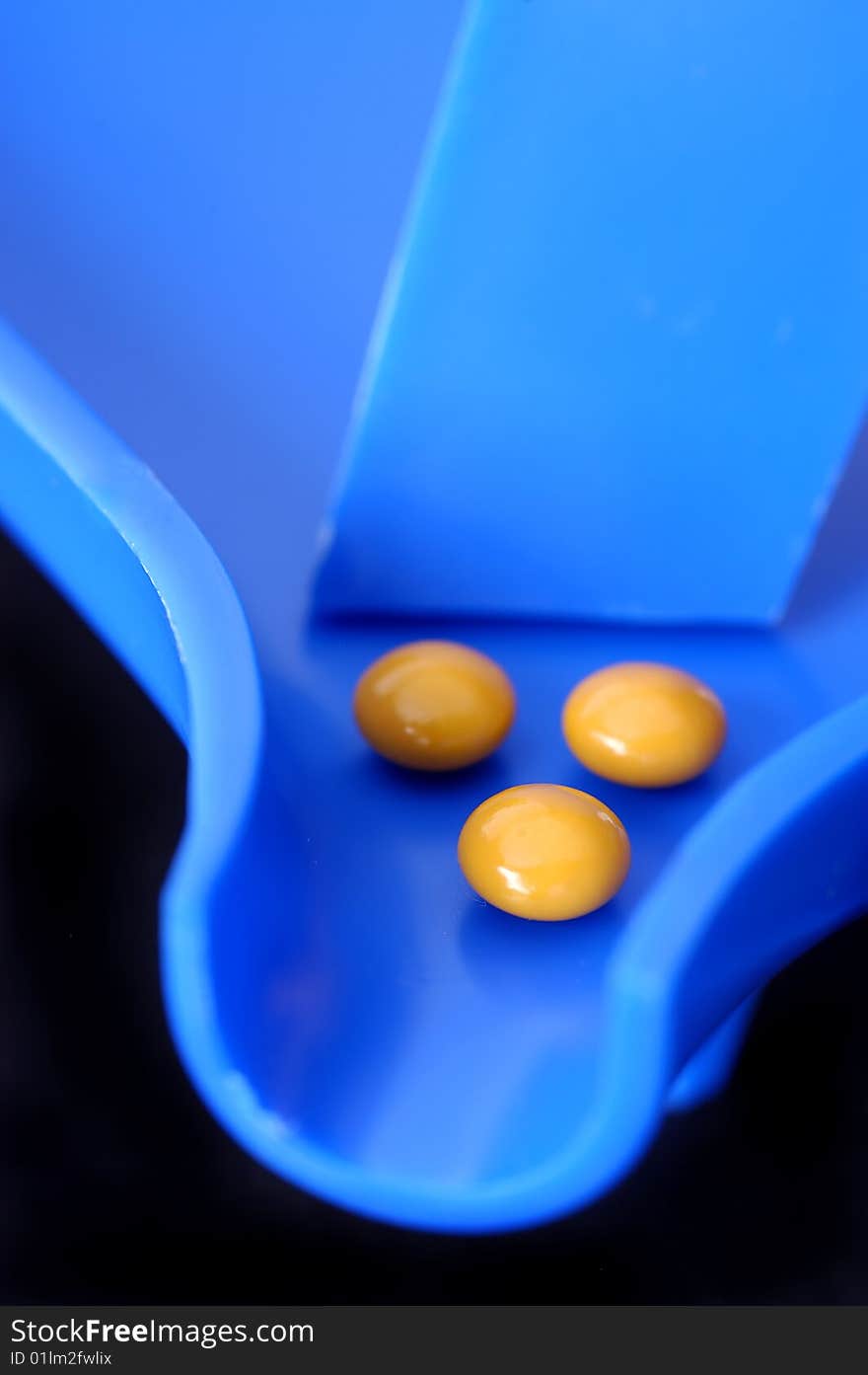 Three Tablets On A Blue Pill Counter