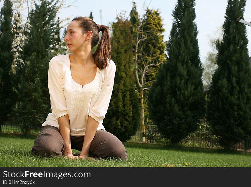 Woman in garden resting on the ground