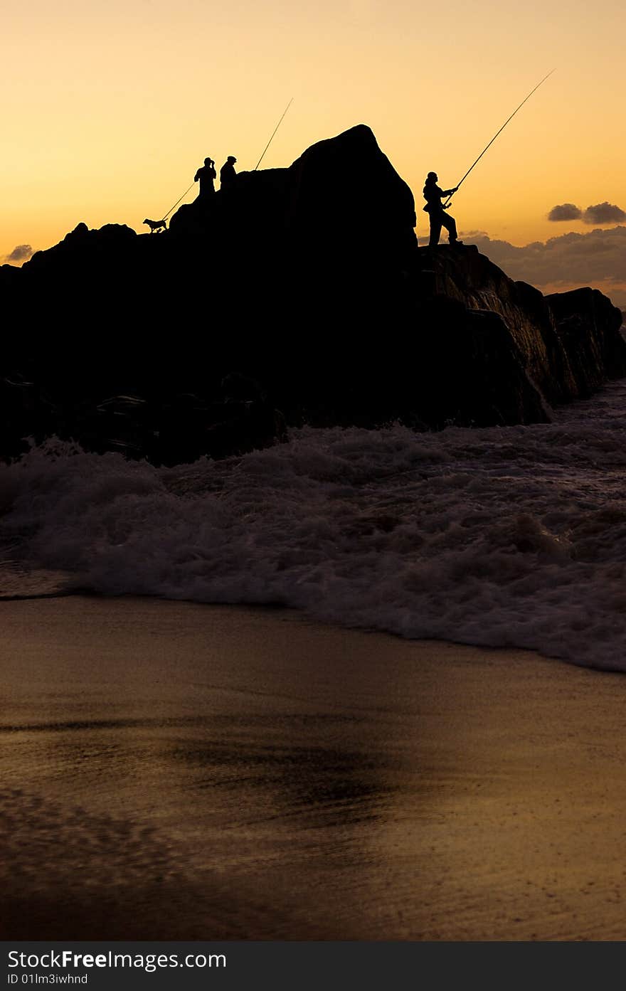 The silhouette of fisherman at the sea. The silhouette of fisherman at the sea