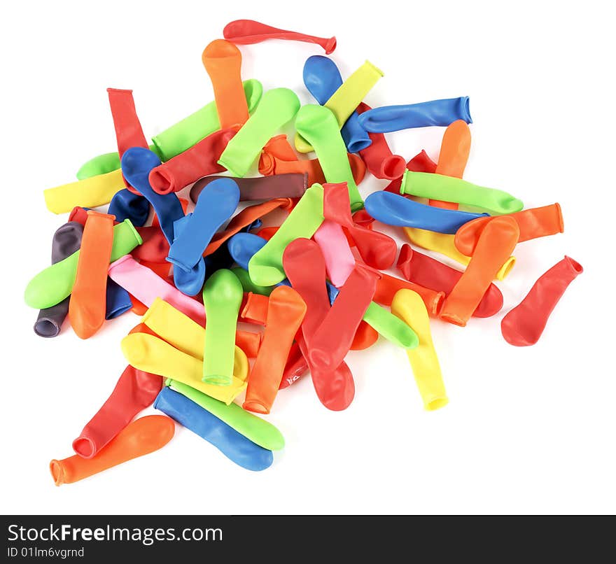 Stack of colored balloons on a white