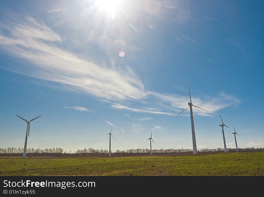 Wind power station against the sky and clouds