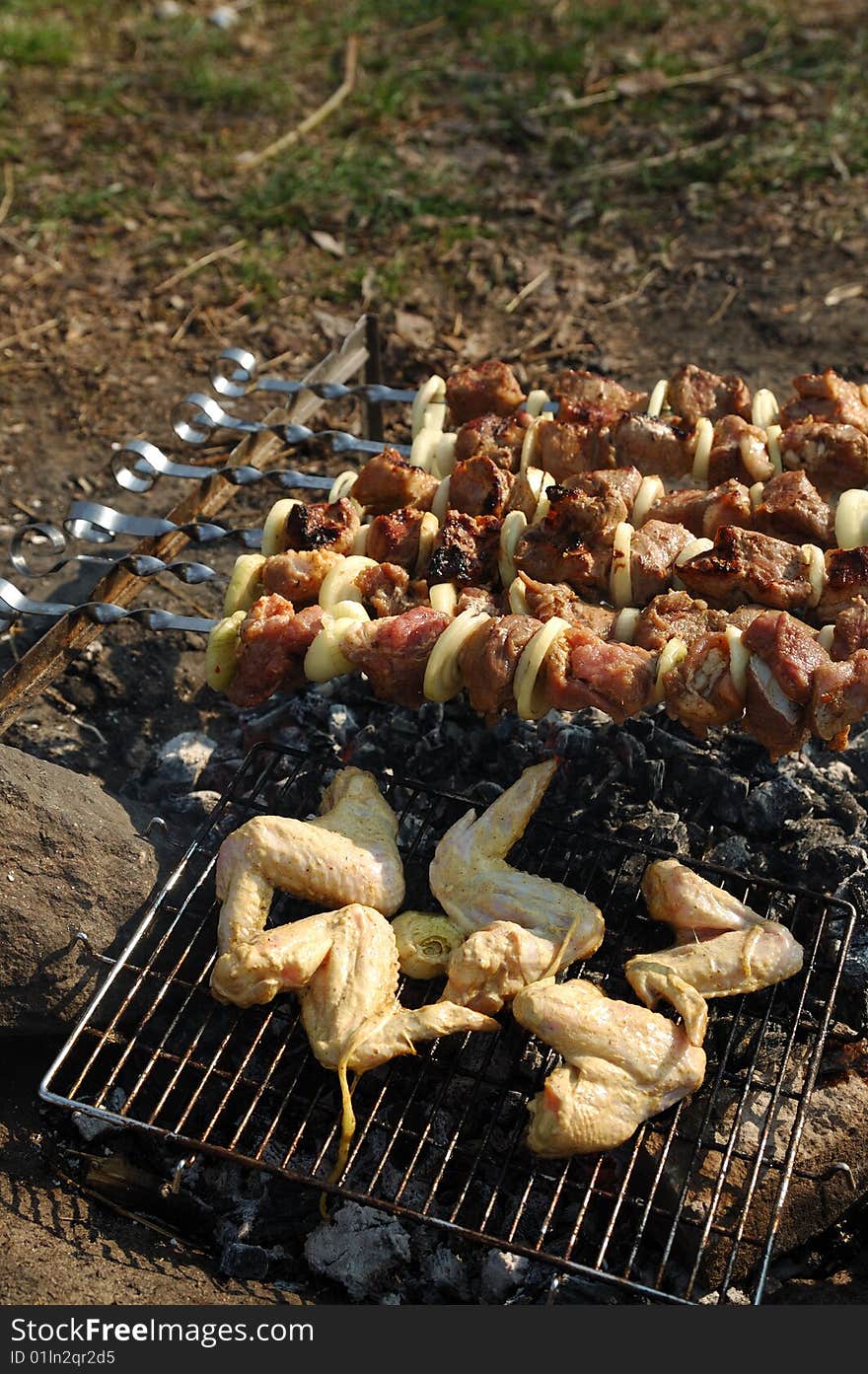 Grilled meat cooking on a coal. Grilled meat cooking on a coal