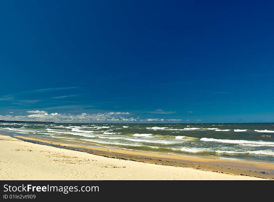 Bright sunny day, the sea, the sun, sand, a beach.