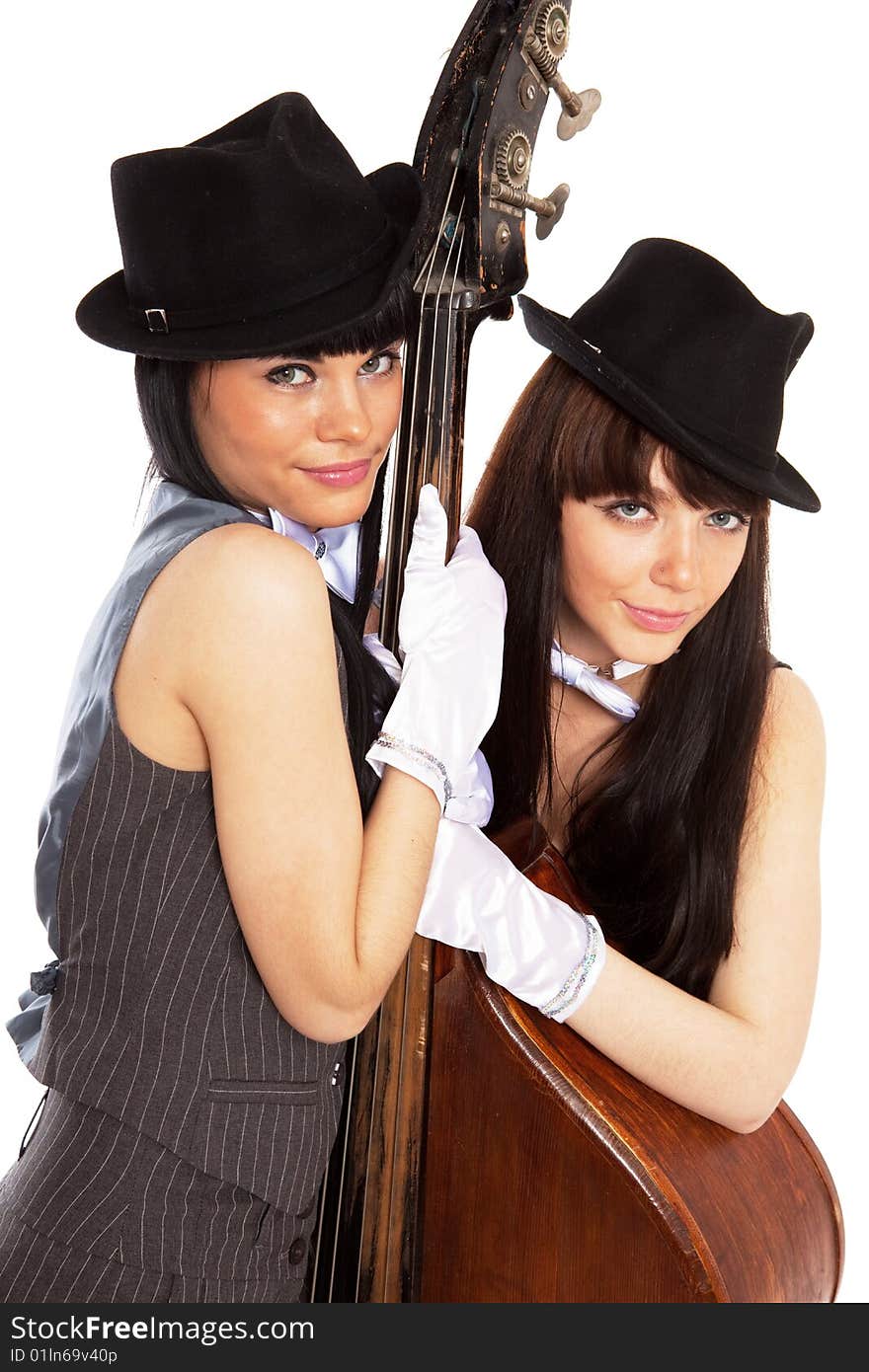 Two young beautiful brunettes with old contrabass