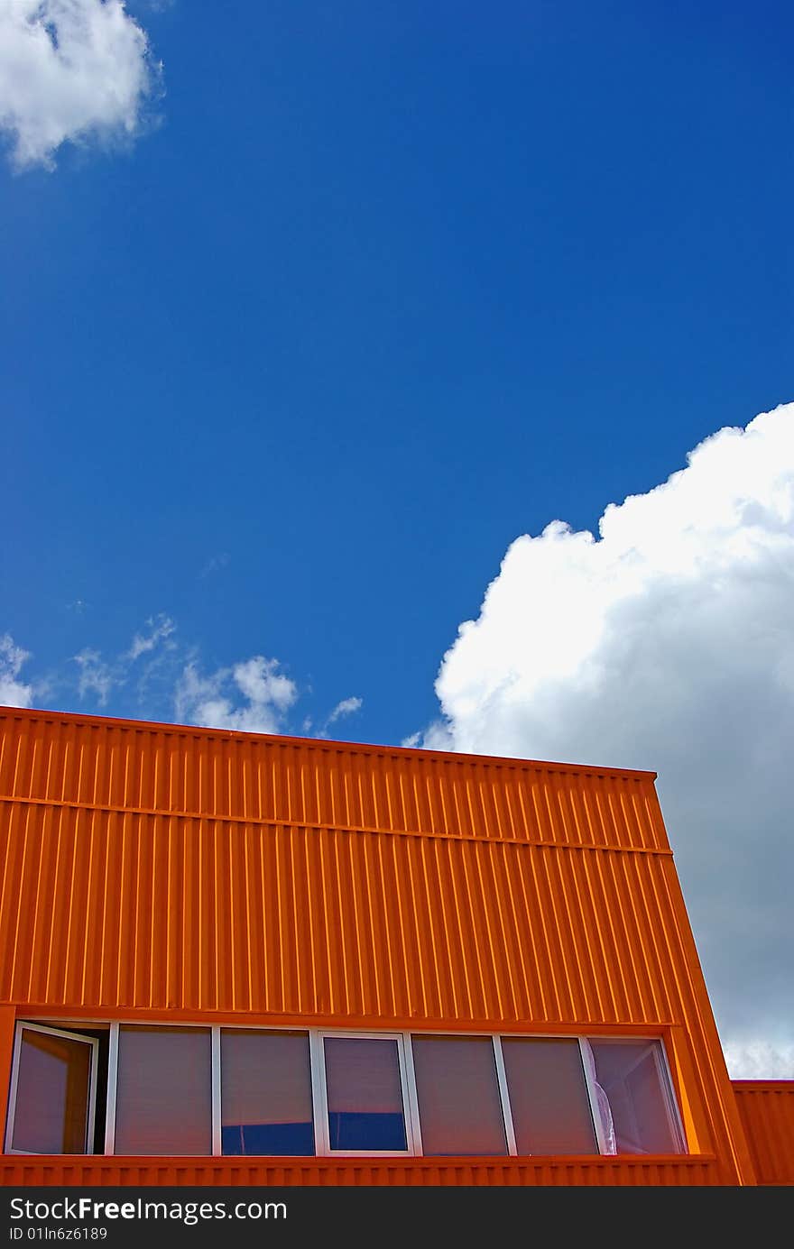 Orange Building With Cloudy Sky