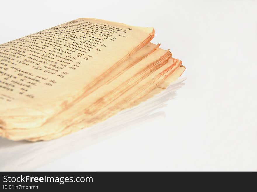 Open antique book with yellowed grunge pages on white background. Open antique book with yellowed grunge pages on white background