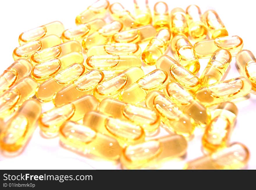 Macro Of  Bunch Of Yellow Gel Pills