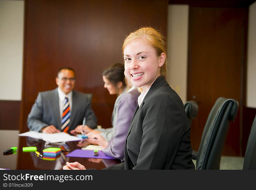 Woman in a team meeting with work colleagues. Woman in a team meeting with work colleagues