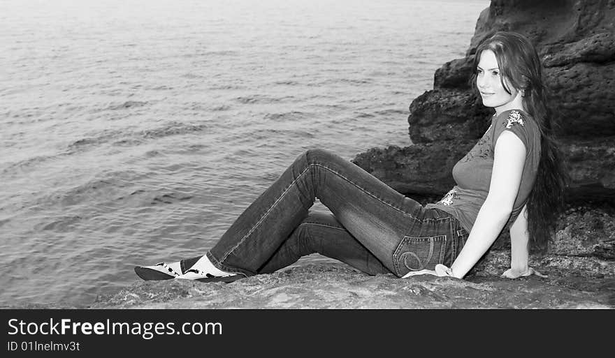 Beautiful girl admiring the sea. Beautiful girl admiring the sea