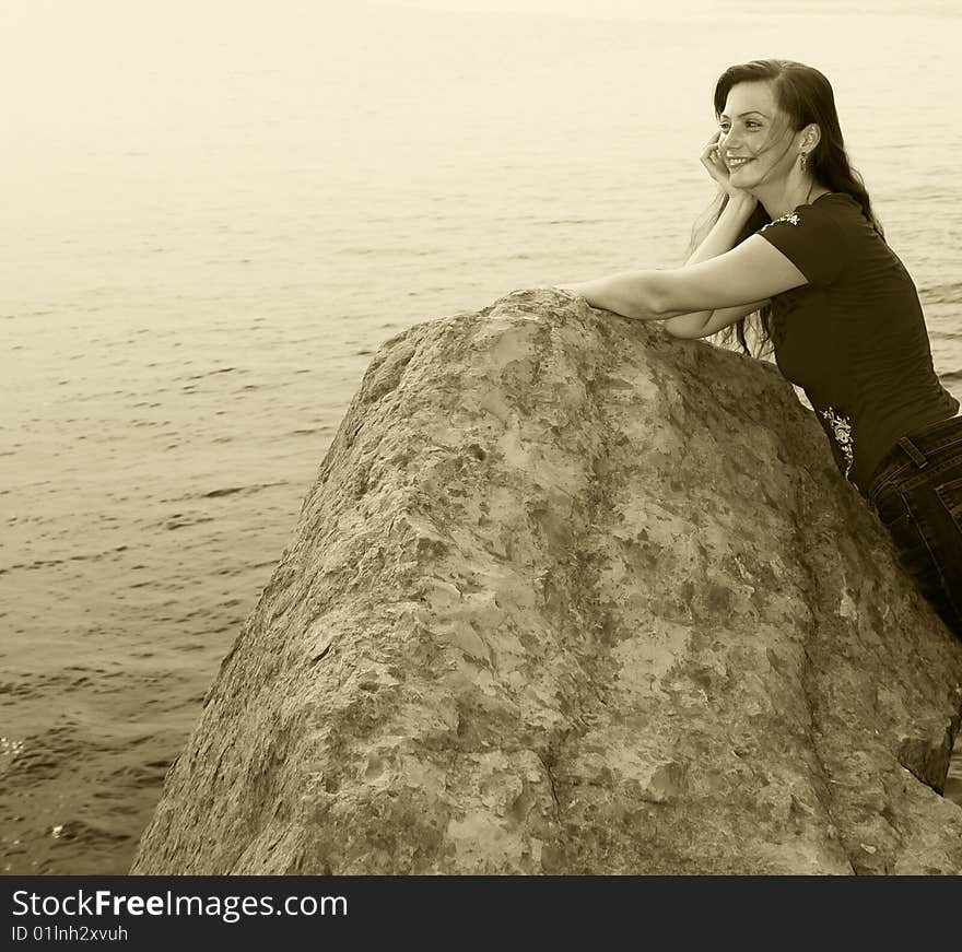 Beautiful girl admiring the sea and laughing. Beautiful girl admiring the sea and laughing