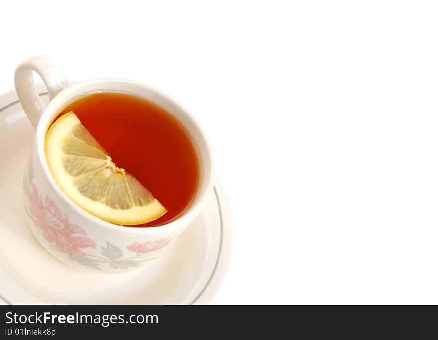 Cup of Tea with lemon slice.