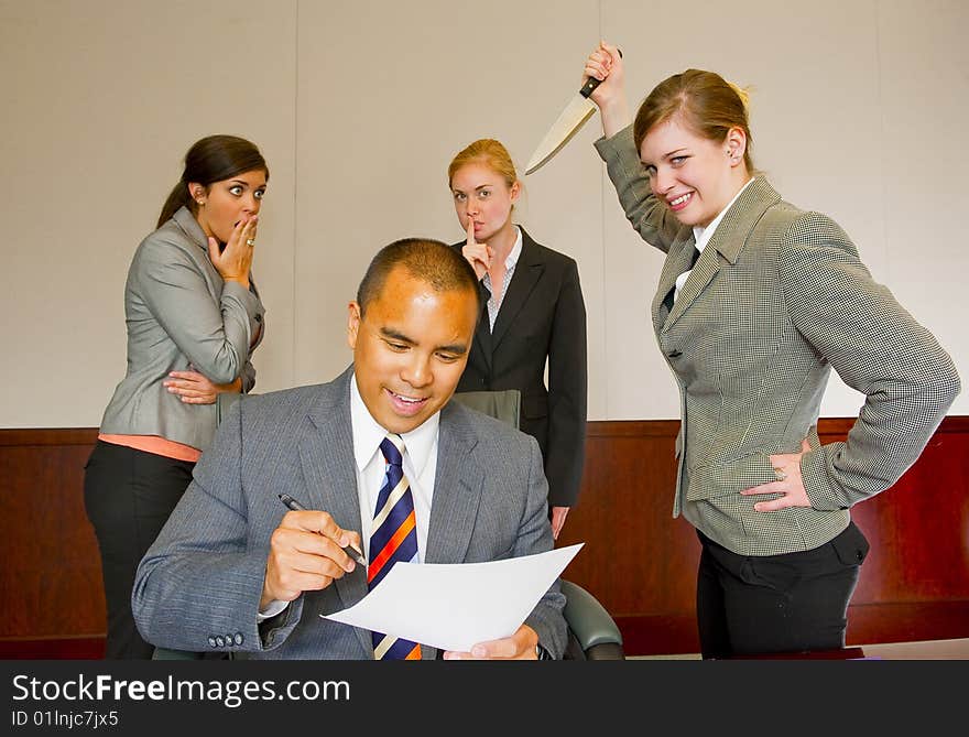 Team member stabbing the manager in the back