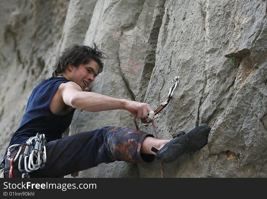 Climber in action on limestone rock