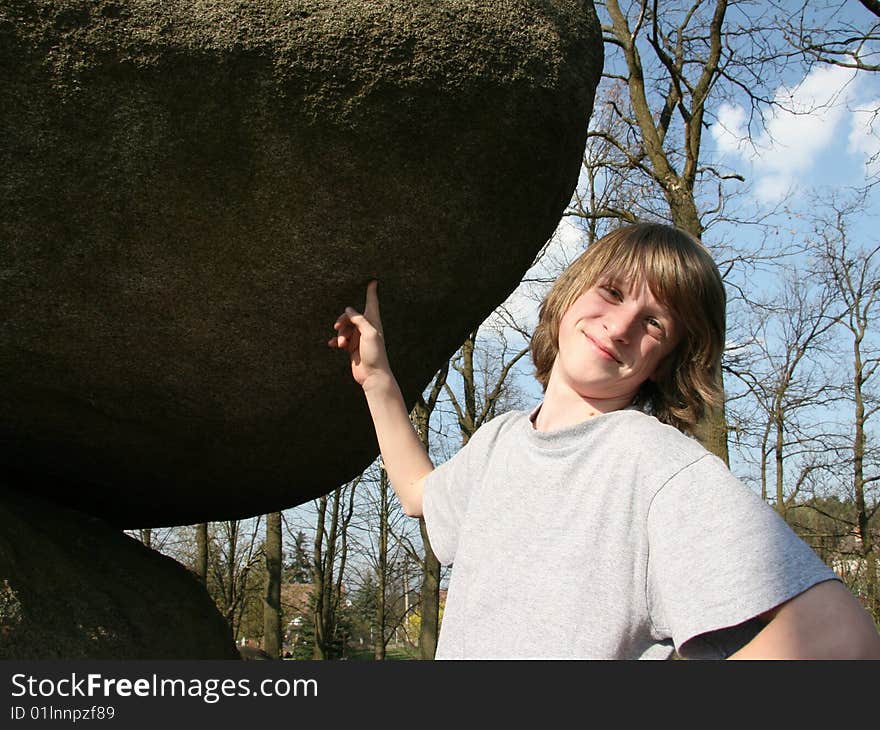 Boy and rocking stone