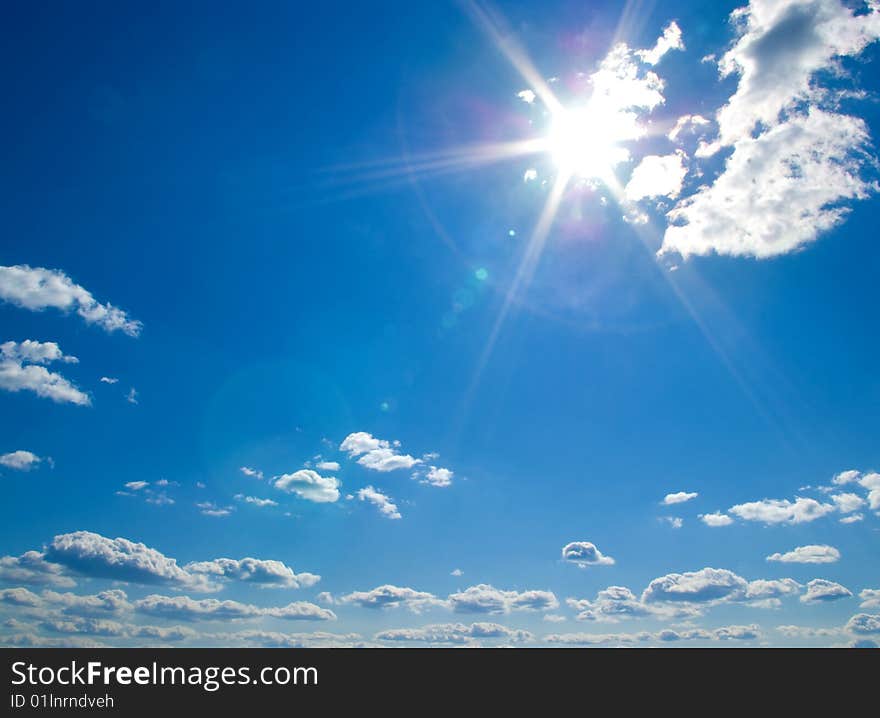 White clouds in a blue sky as background. White clouds in a blue sky as background