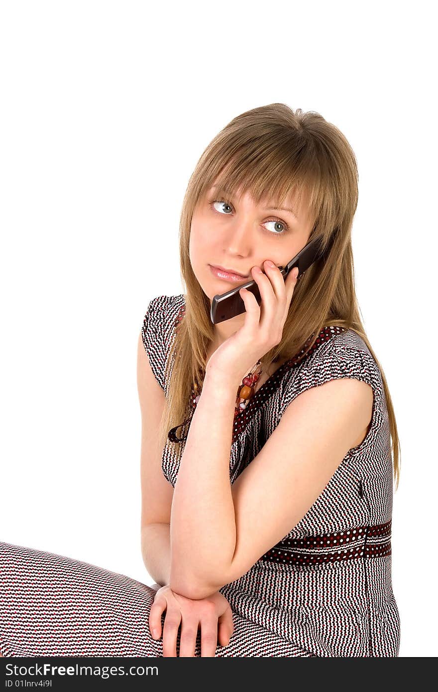 Young woman listens on a mobile phone