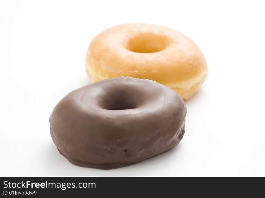 Breakfast glass of chocolate milk and donut isolated