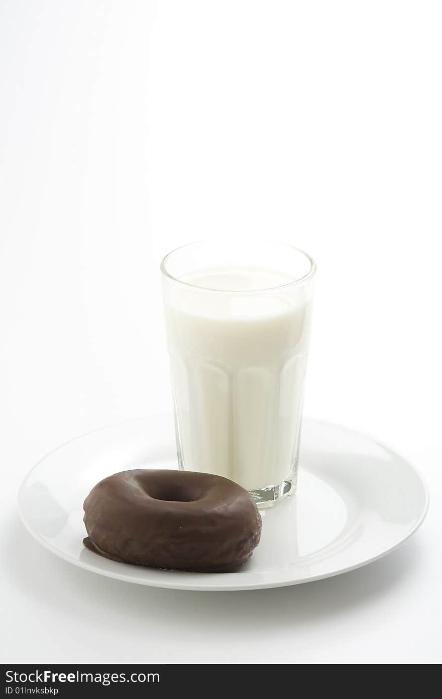 Breakfast glass of chocolate milk and donut