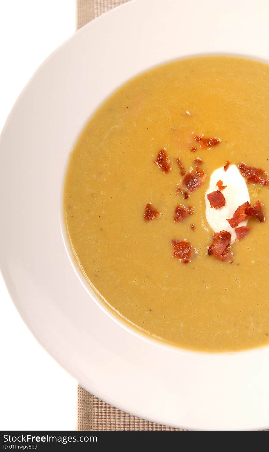 Homemade split pea soup with sour cream and bacon