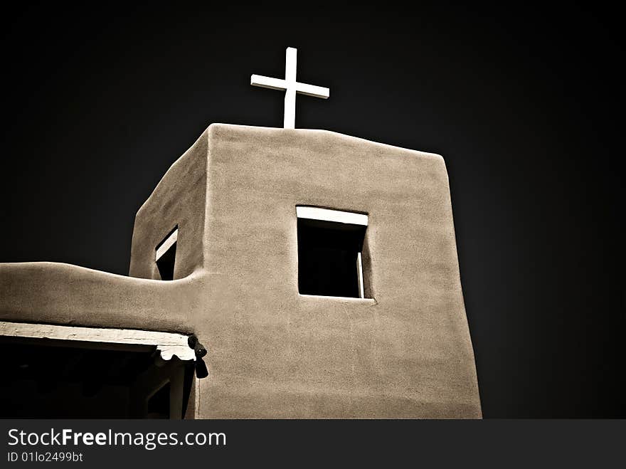 Partial view of adobe church in New Mexico. Dark cross-processed image. Partial view of adobe church in New Mexico. Dark cross-processed image