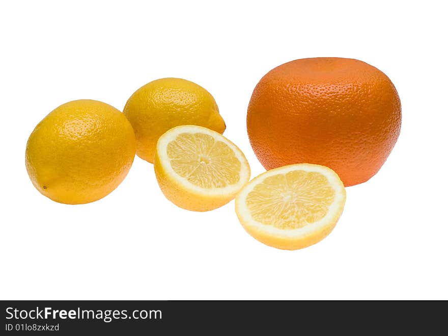 One orange and three lemons one of which is divided in half lying together on isolated white background. One orange and three lemons one of which is divided in half lying together on isolated white background