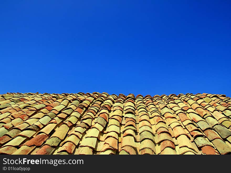 Terracotta roof on blue summer sky background. Sicily Italy