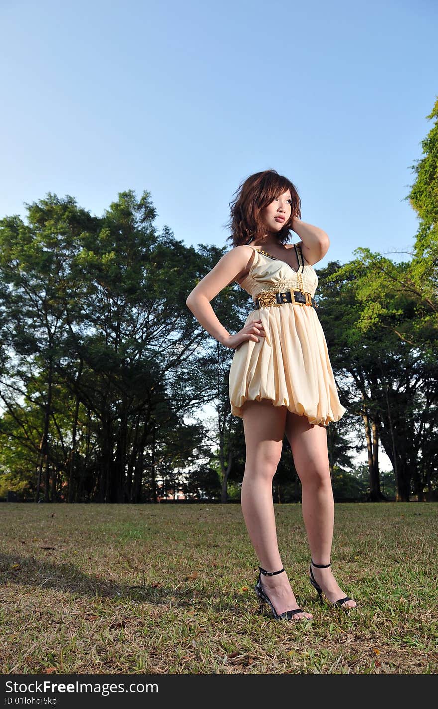 Beautiful Asian Woman wearing dress in the park. Beautiful Asian Woman wearing dress in the park.