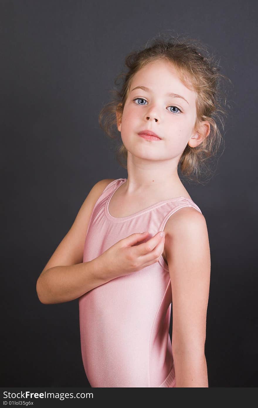 Young ballet dancer wearing an leotard and skirt. Young ballet dancer wearing an leotard and skirt