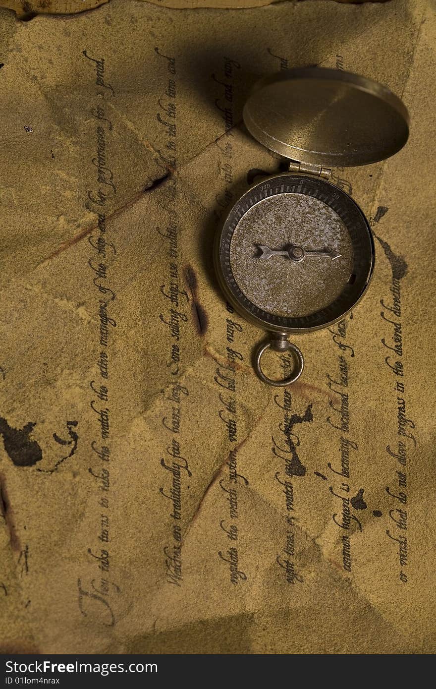 A beautiful old compass on an old letter