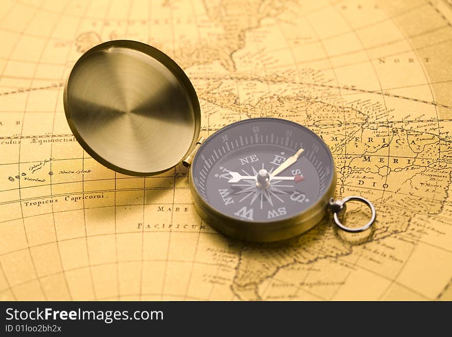 A beautiful old compass on an old map