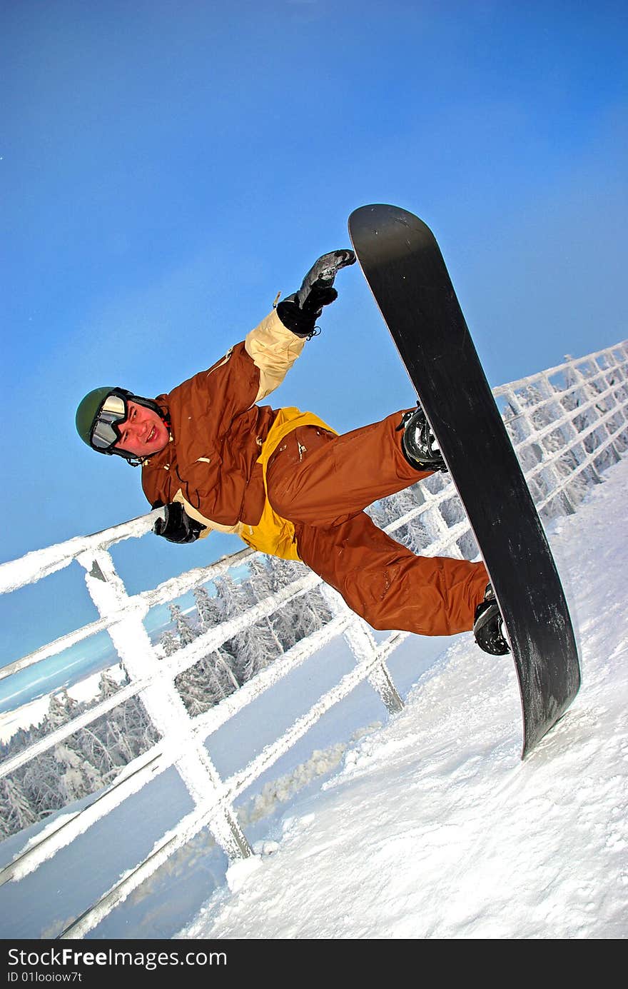 Snowboarder funning on the top of slope