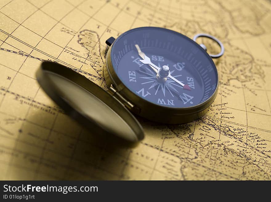 A beautiful old compass on an old map