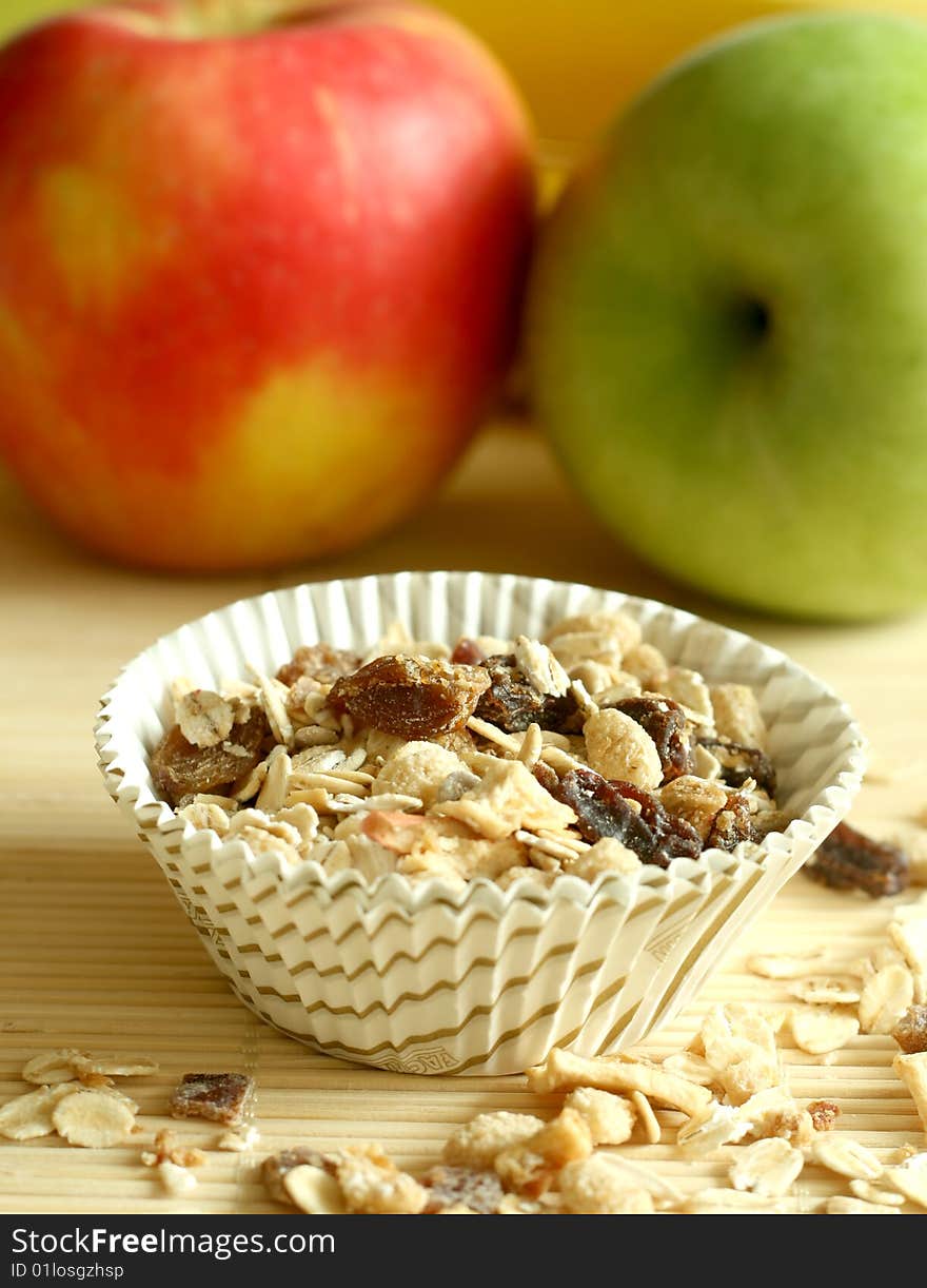 Muesli and green and red apples, breakfast. Muesli and green and red apples, breakfast