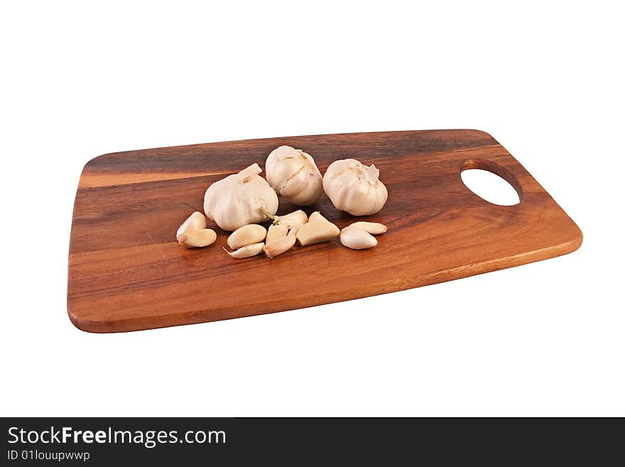 Multiple garlic on cutting board