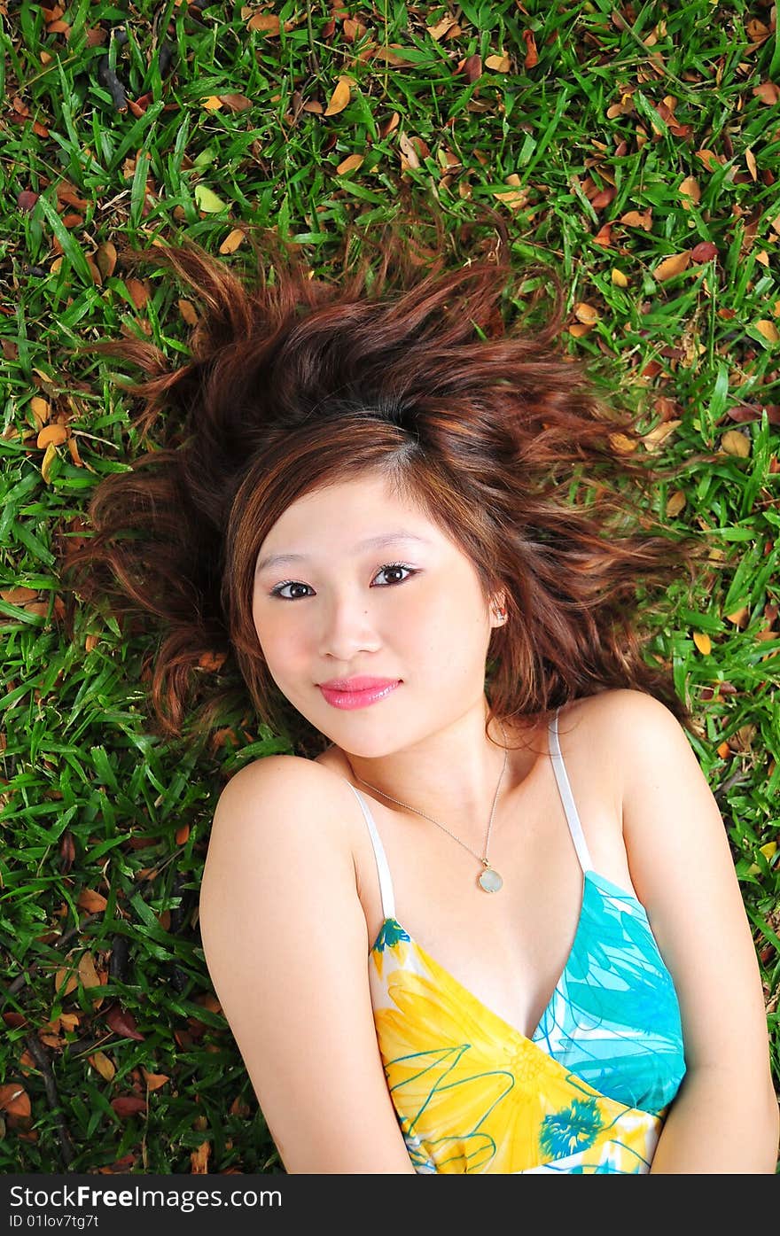 Beautiful Asian Woman In The Park