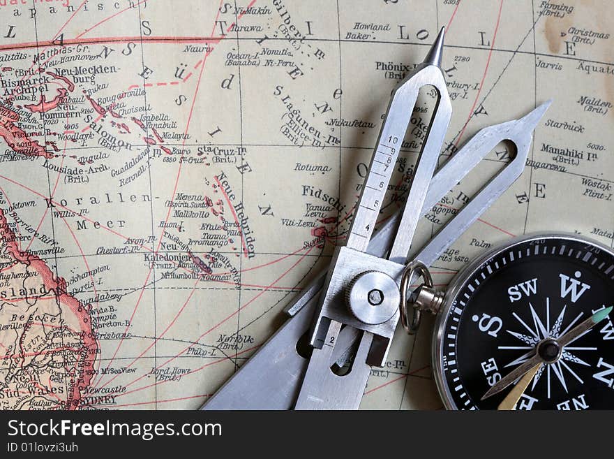 Proportional Dividers and compass on background with old map. Proportional Dividers and compass on background with old map