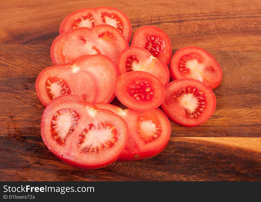 Sliced tomatoes on cutting board