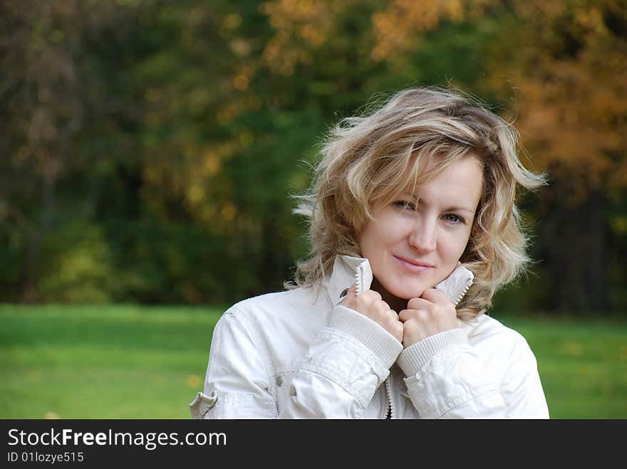 Young beautiful woman in white jacket