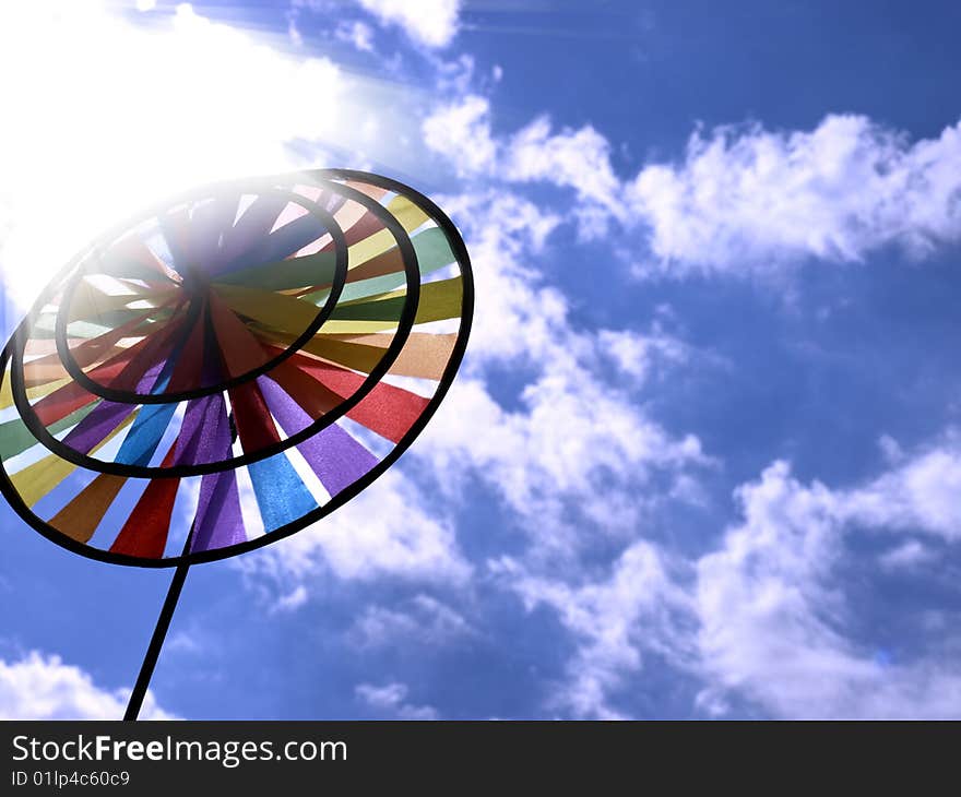 Beautiful toy rainbow on background blue sky. Beautiful toy rainbow on background blue sky