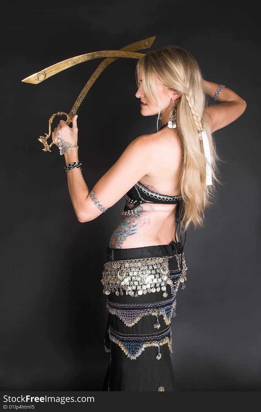 Belly Dancer hands holding two tribal swords