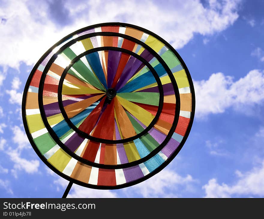 Beautiful toy rainbow on background blue sky. Beautiful toy rainbow on background blue sky