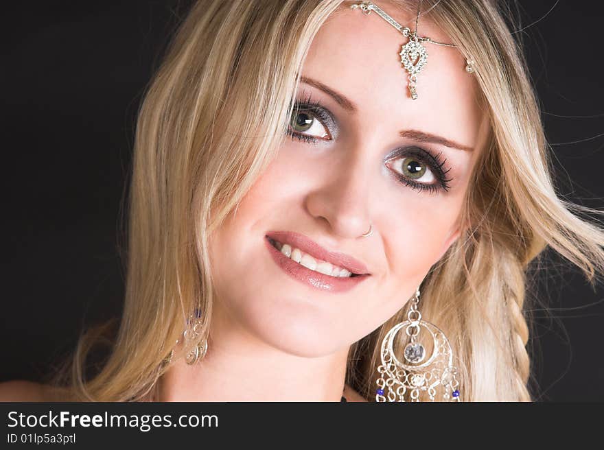 Beautiful Blond Belly Dancer with traditional jewelery