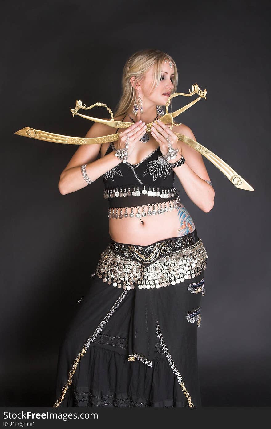 Belly Dancer hands holding traditional tribal swords