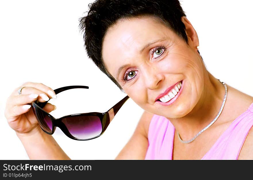 Mature woman with sunglasses on white background