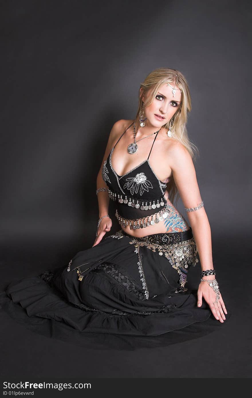 Beautiful Blond Belly Dancer in a traditional black costume